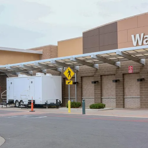 A Rocket Restrooms trailer placed at a retail site for a long term rental